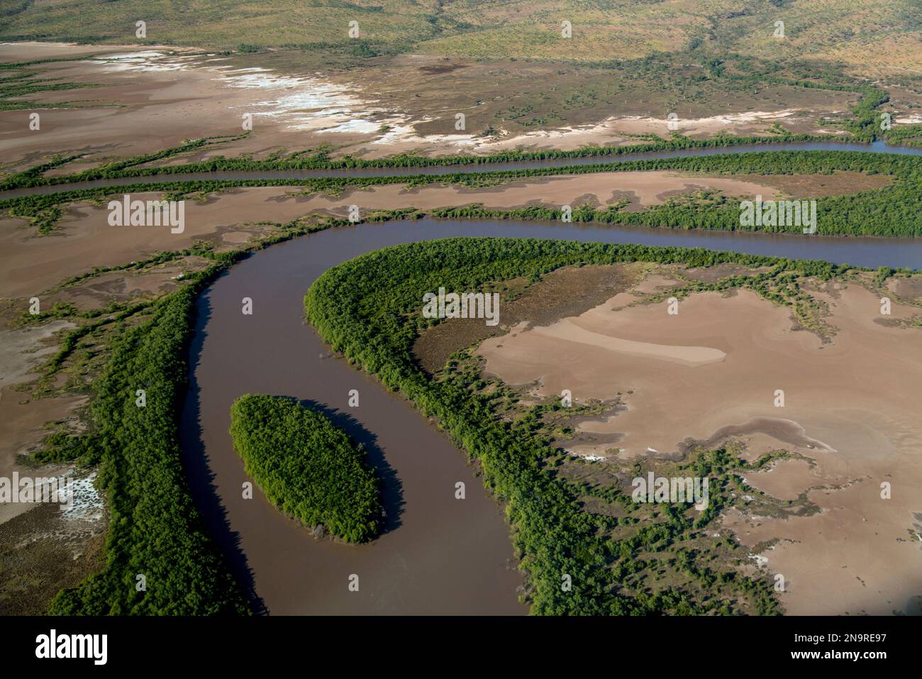 Aerial view of a river with an oxbow and island, over Purnululu ...