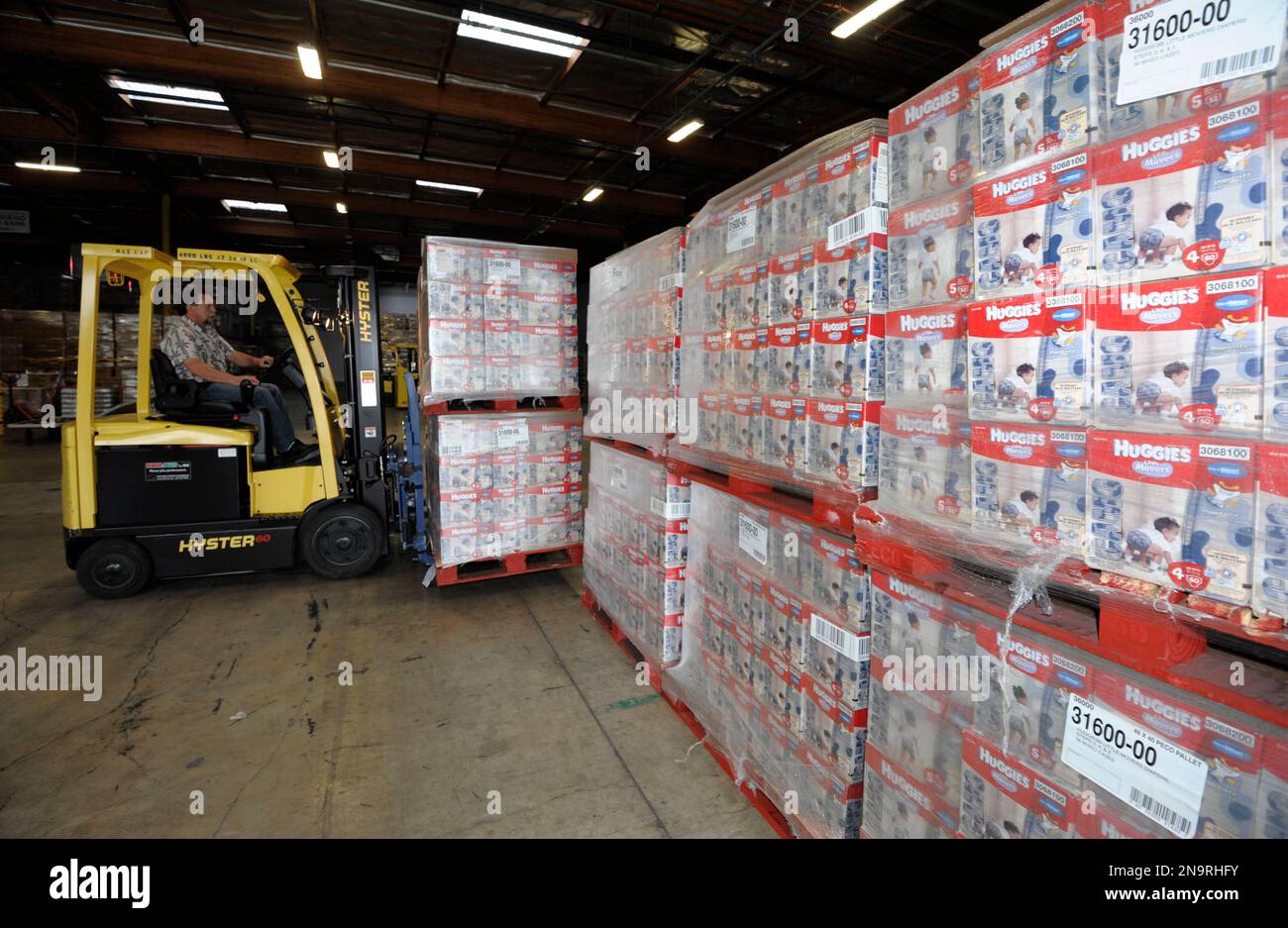 Boxes of Huggies Camo Diapers are unloaded from a truck at the San