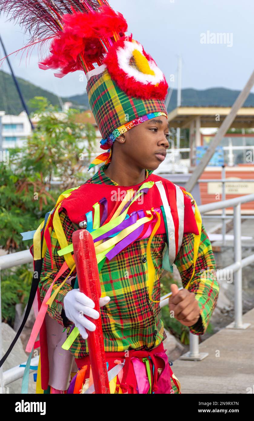 Masquerade Dancer on cruise ship pier, Basseterre, St. Kitts, St. Kitts and Nevis, Lesser Antilles, Caribbean Stock Photo