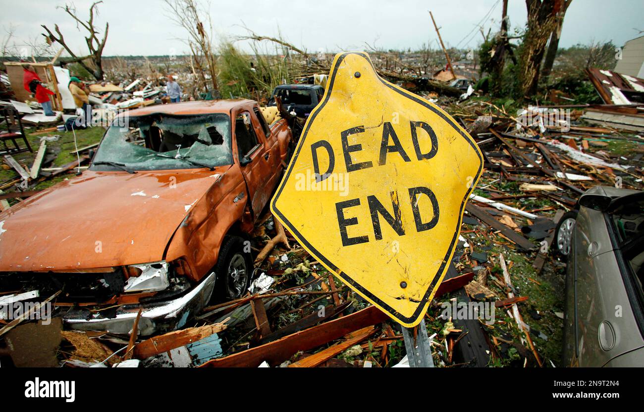FILE-In this May 23, 2011 file photo, a mangled street sign stands ...