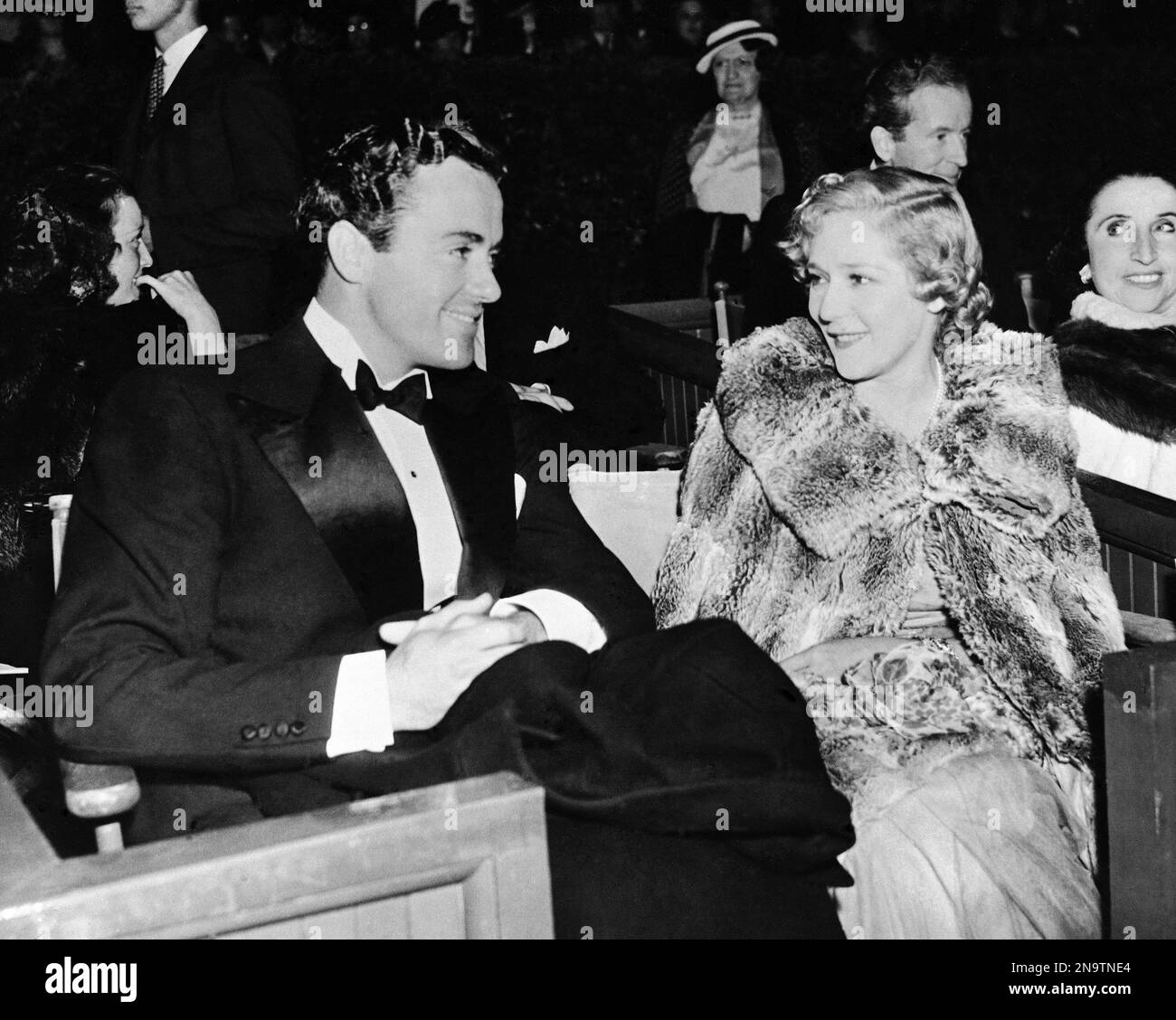 American musician and actor Charles 'Buddy' Rogers sits with American ...