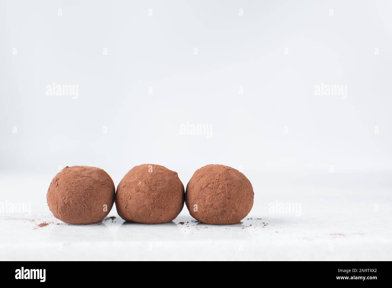 chocolate truffles covered in cocoa powder, homemade chocolate bonbons