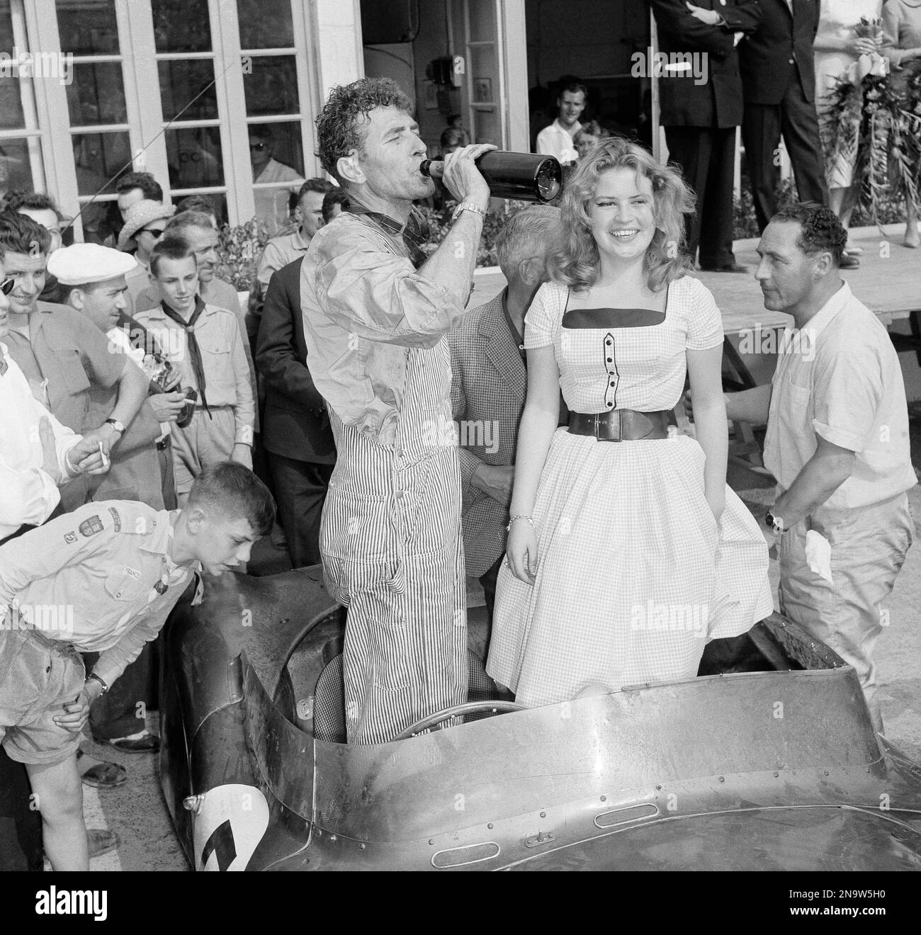 race car driver champagne up dress FILE