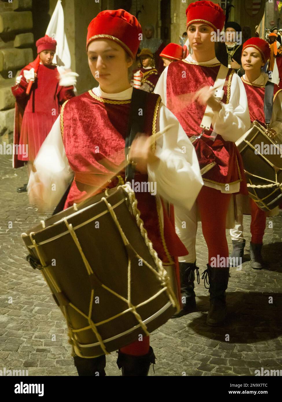 Young drummers parading in historical costumes throught the city streets at night, Fermo, Marche, Italy © Renzo Frontoni / Axiom Stock Photo