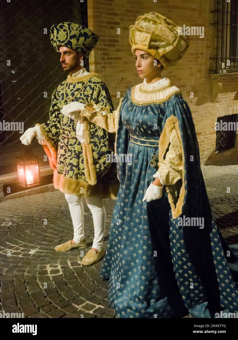 A late medieval-early renaissance knight holding his lady's hand and carrying a lamp, Fermo, Marche, Italy © Renzo Frontoni / Axiom Stock Photo