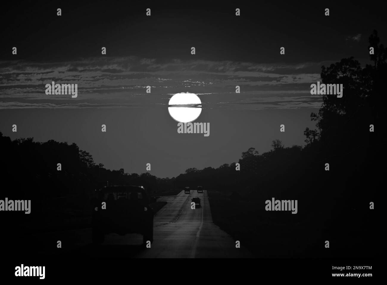 Sunset highway. Dramatic sun. Freeway roadtrip journey, scenery