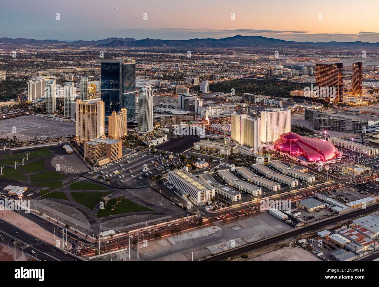 Aerial evening view of the Las Vegas Strip including Circus Circus casino and the Canyon Blaster. Stock Photo
