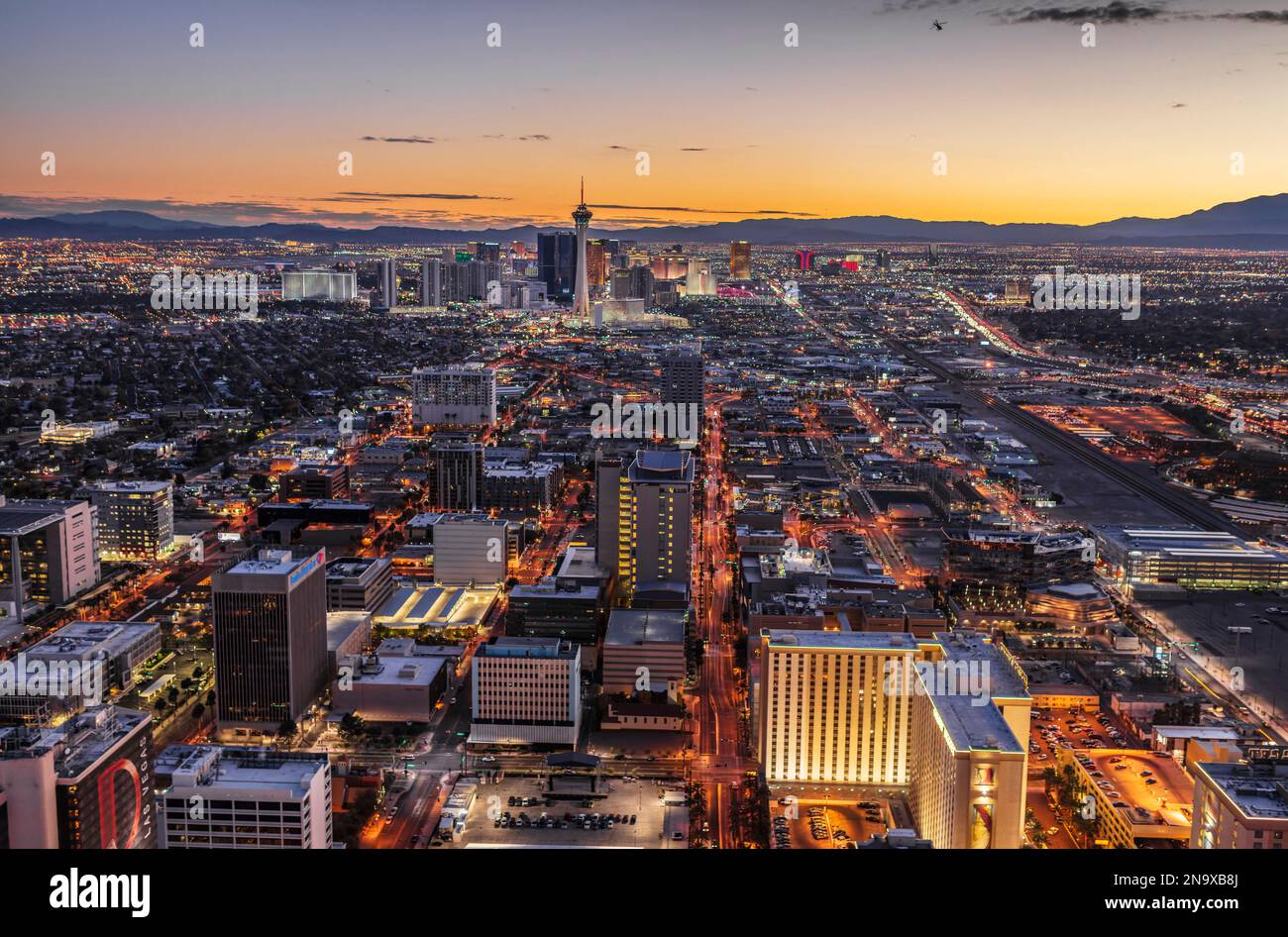 Aerial night view of Las Vegas, Nevada with sightseeing helicopter ...