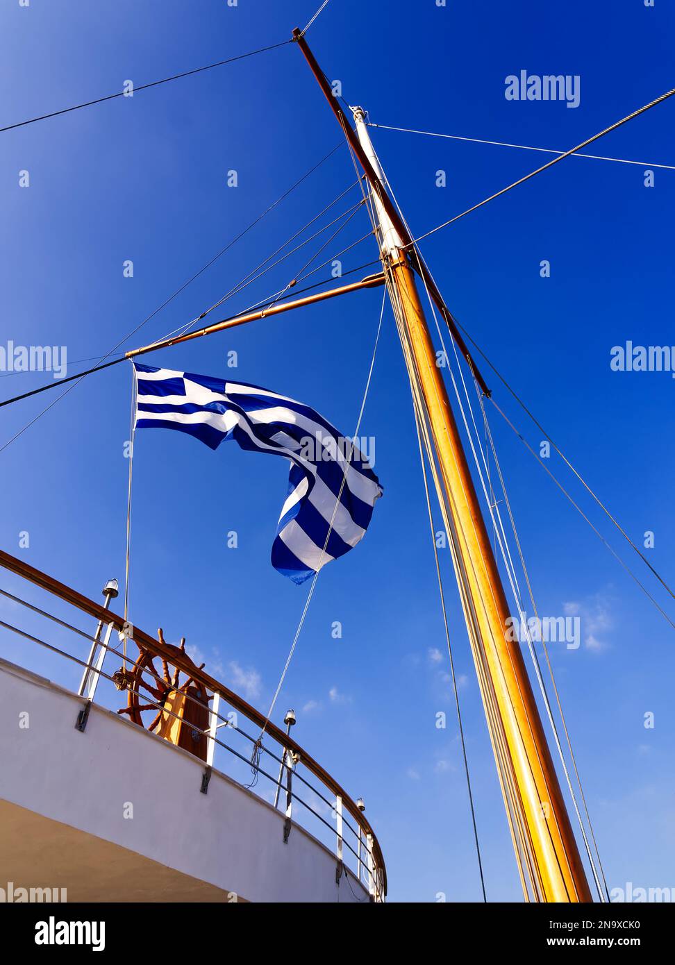 Greek flag floating in a sailing boat, Athens, Greece Stock Photo