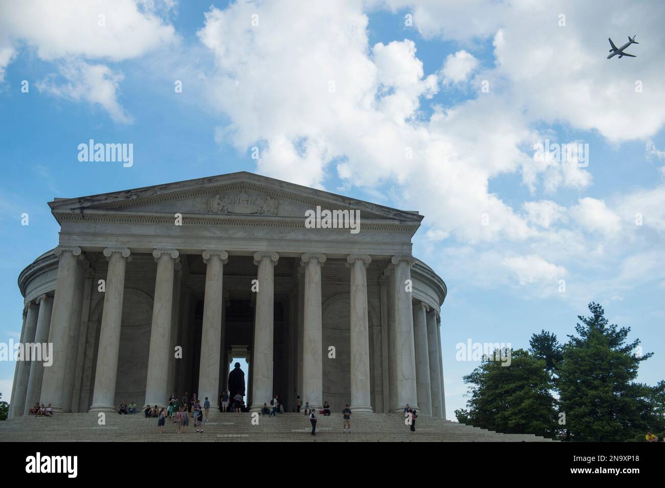 Airplane flies past the Jefferson Memorial in District of Columbia, Washington, USA; Washington, District of Columbia, United States of America Stock Photo