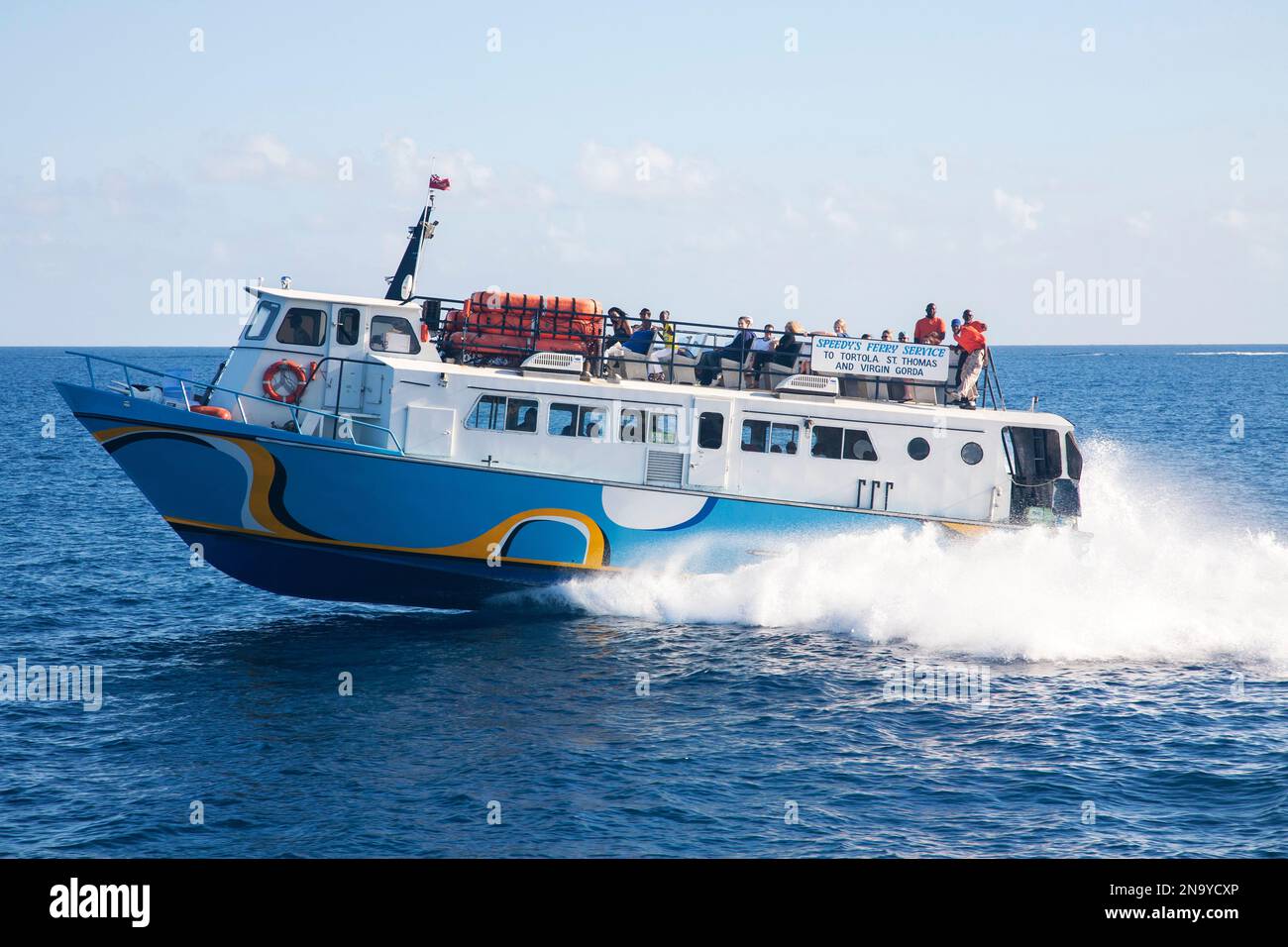 Passengers ride on an inter island ferry to Virgin Gorda in the British