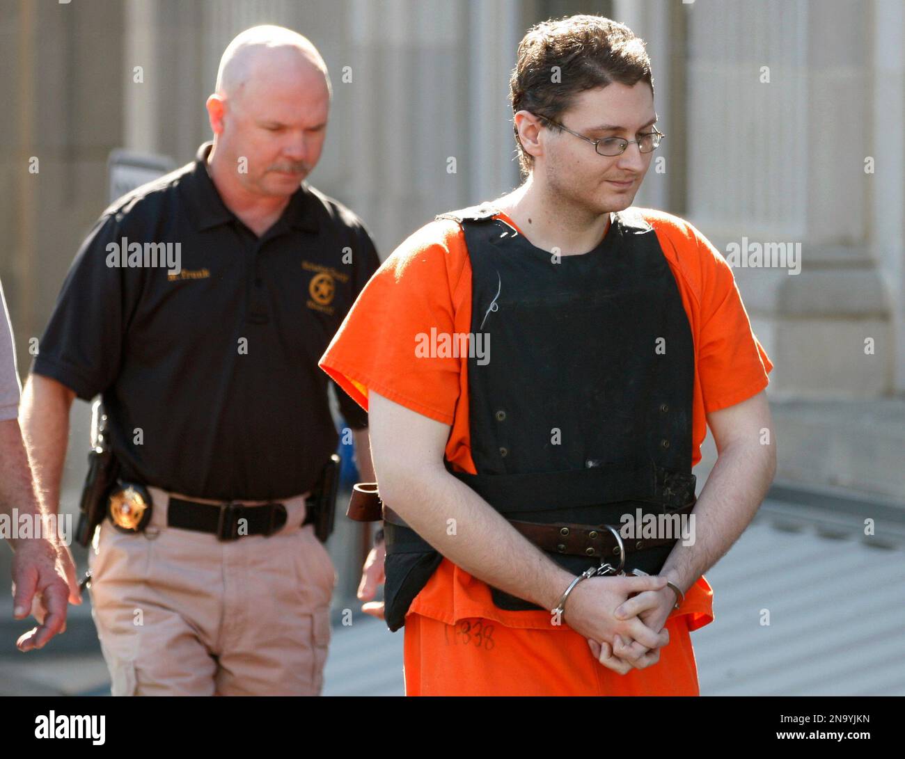 Kevin Sweat is escorted from the courthouse in Okemah, Okla., Monday ...