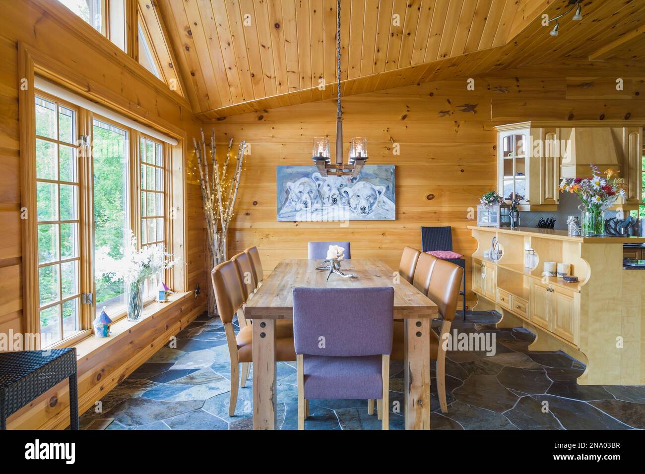 Oak wood dining table with caramel coloured high back leather chairs