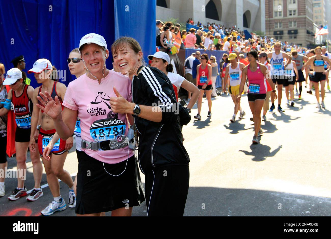 Threetime Boston Marathon women's winner Uta Pippig, in black, of