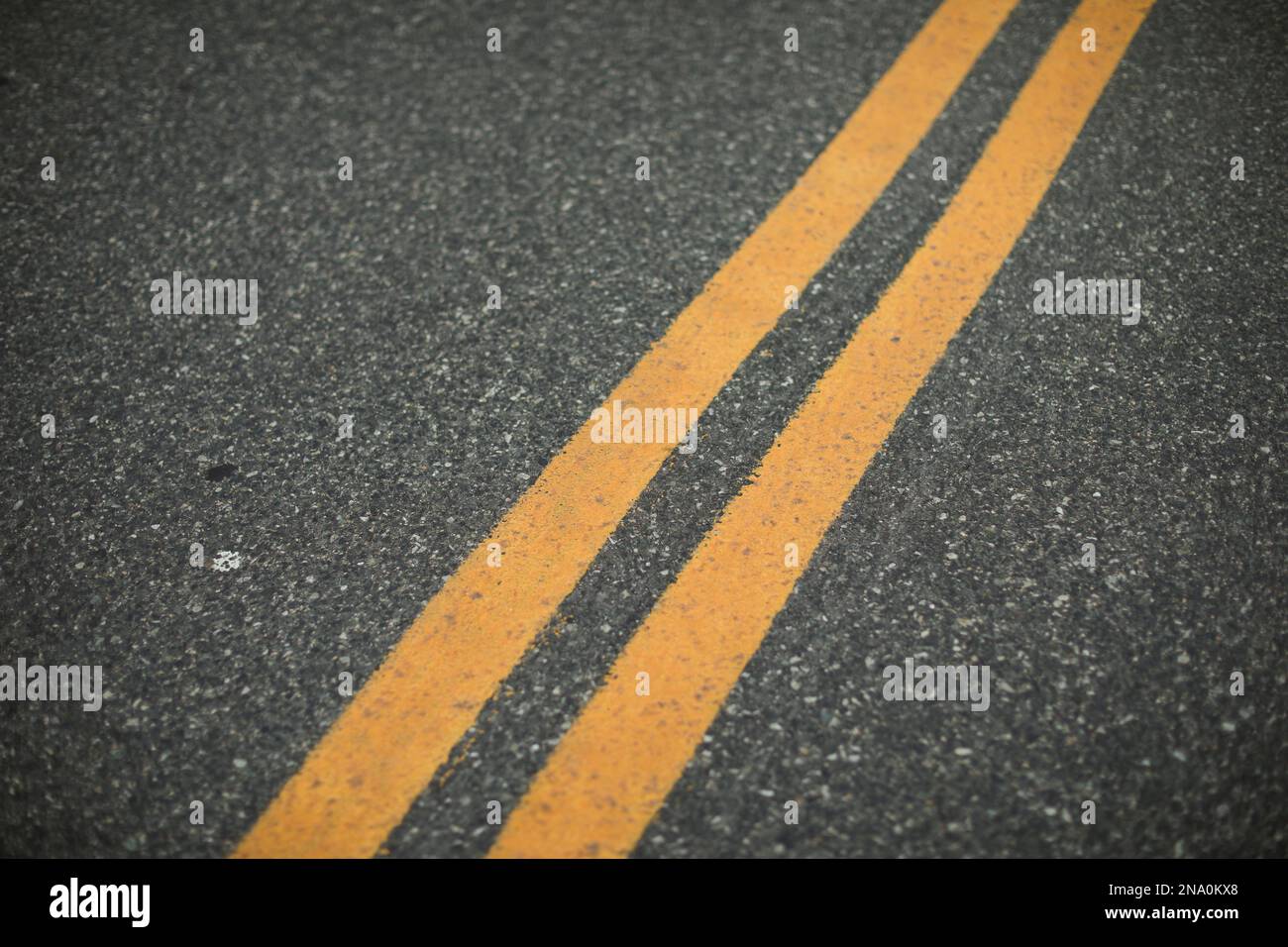 double yellow line in the urban city symbolizing freeway Stock Photo