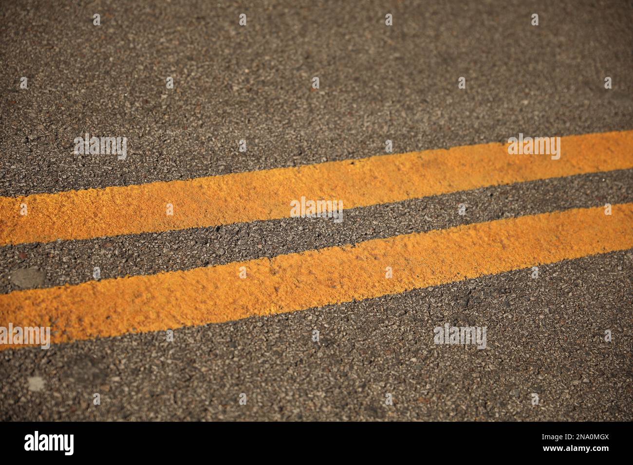 double yellow line in the urban city symbolizing freeway Stock Photo