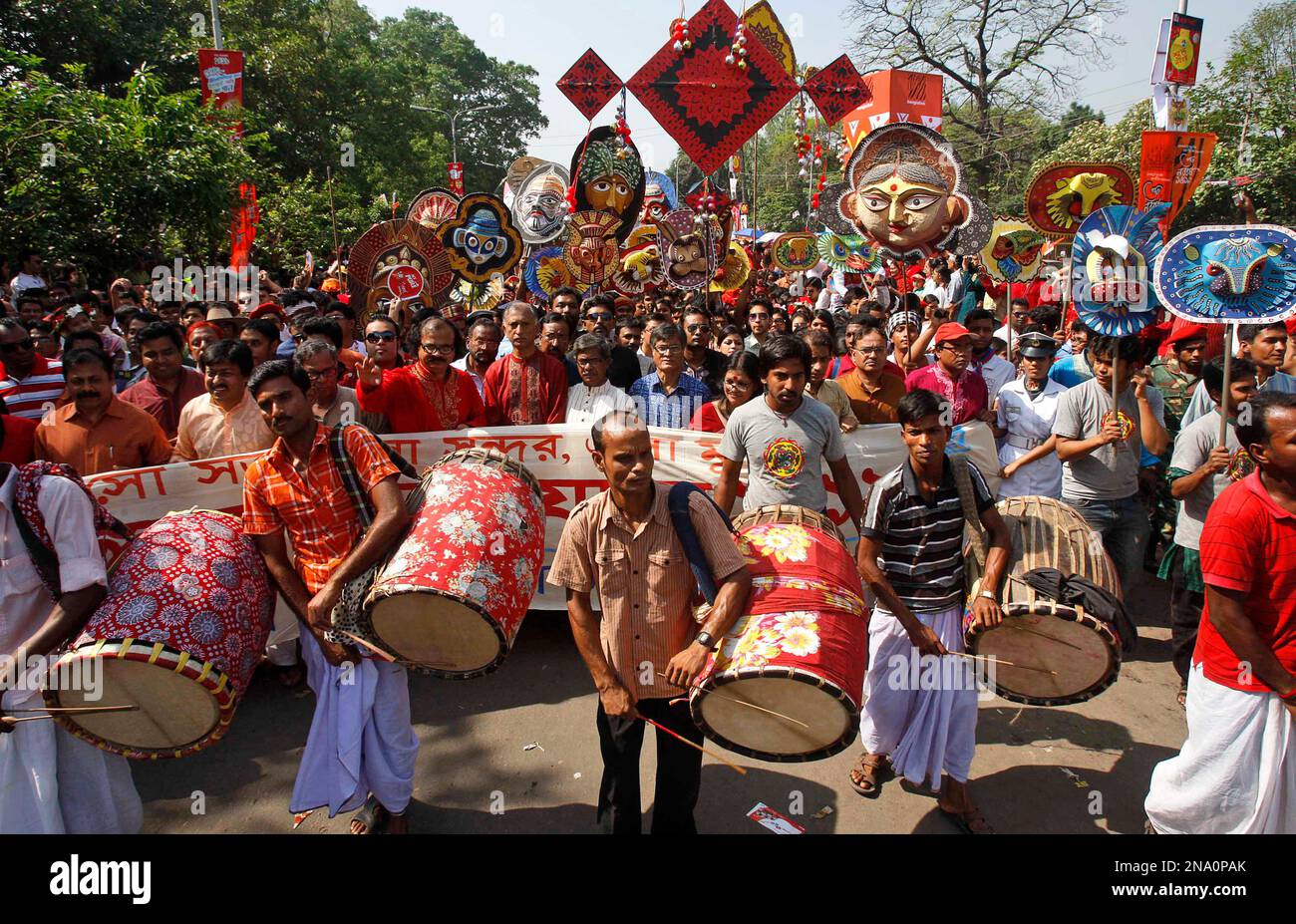Bangladeshis participate in a street parade to celebrate the first day