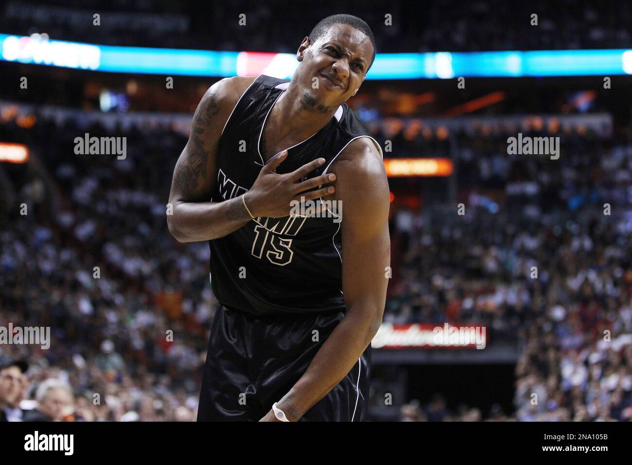 Miami Heat's Marlo Chalmbers grimmaces in pain during the second half