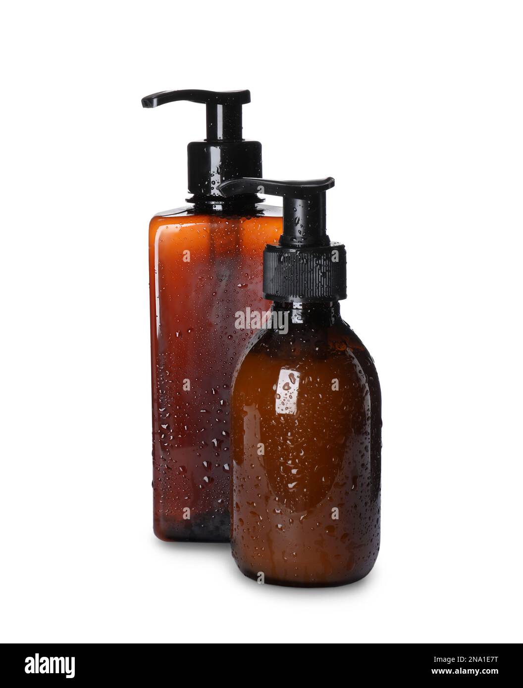 Dispenser bottles with water drops isolated on white. Men's cosmetics