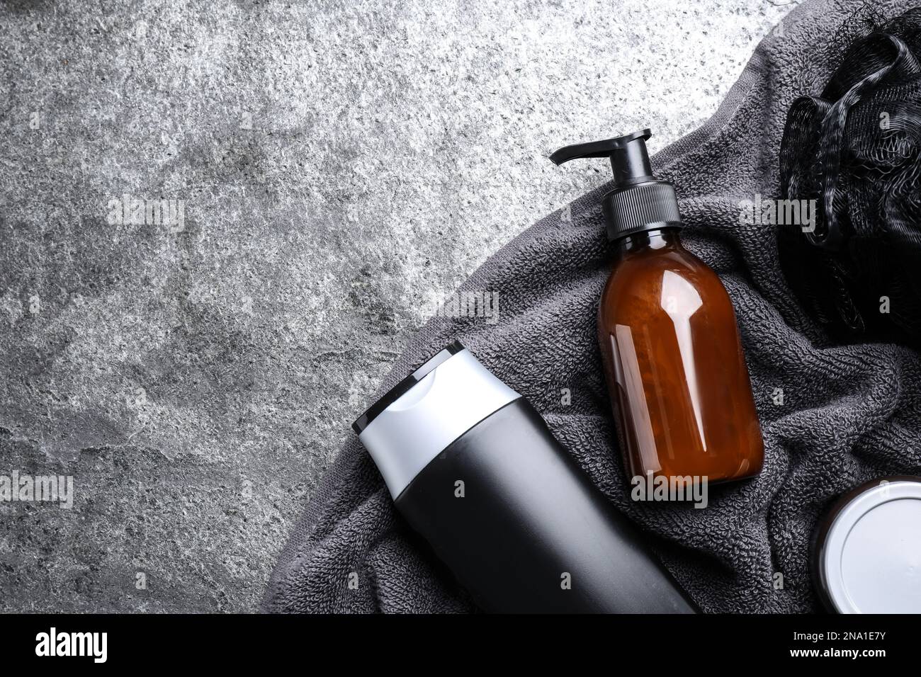 Flat lay composition with men's cosmetics on grey stone background ...