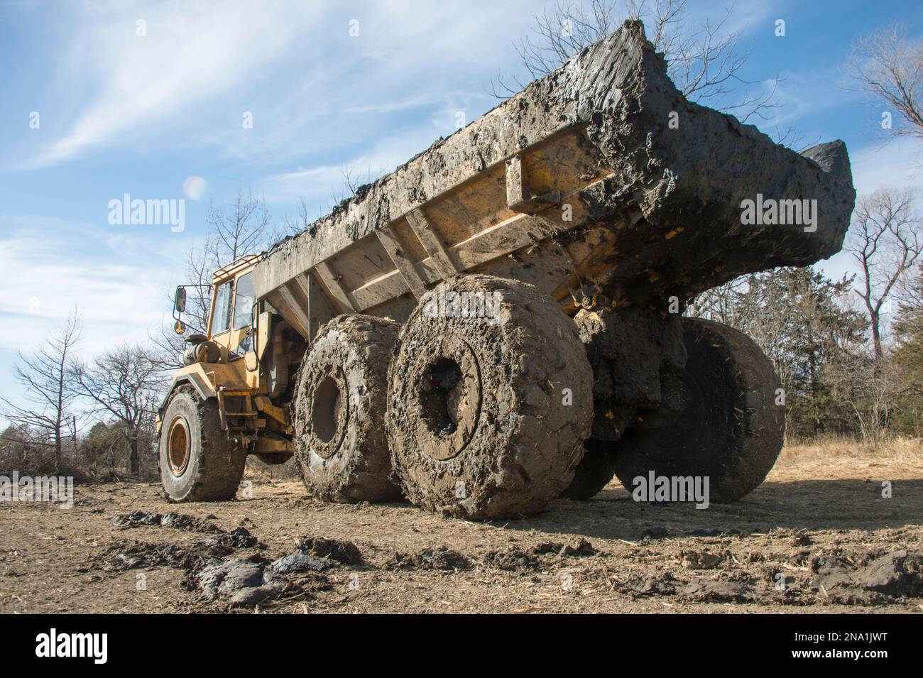 Dump truck covered in mud in rural Nebraska, USA; Nebraska