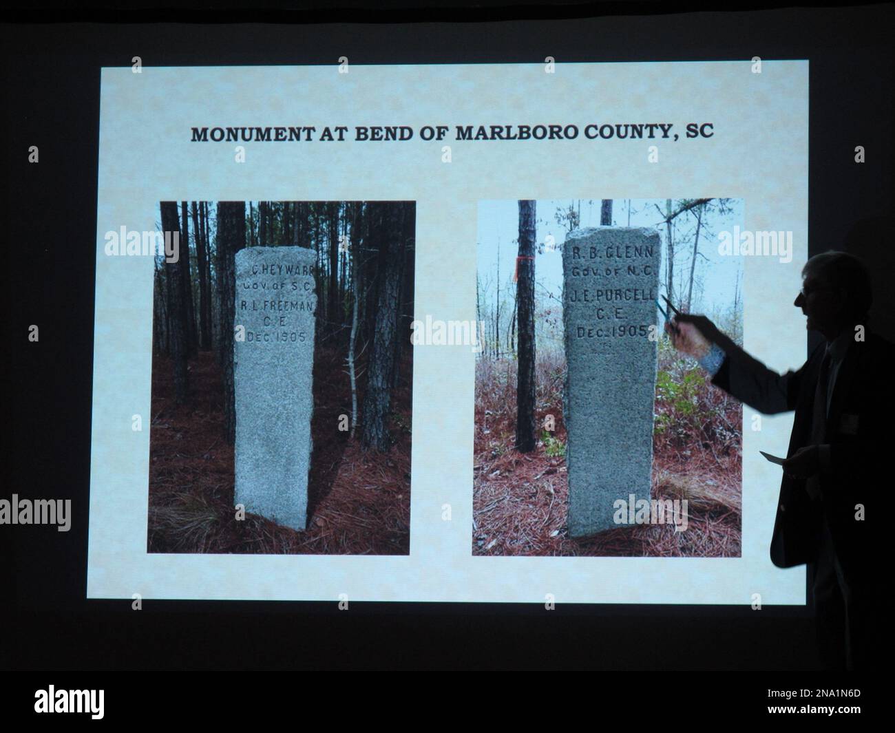 Surveyor AlanJon Zupan shows a stone marker used to mark the North CarolinaSouth Carolina