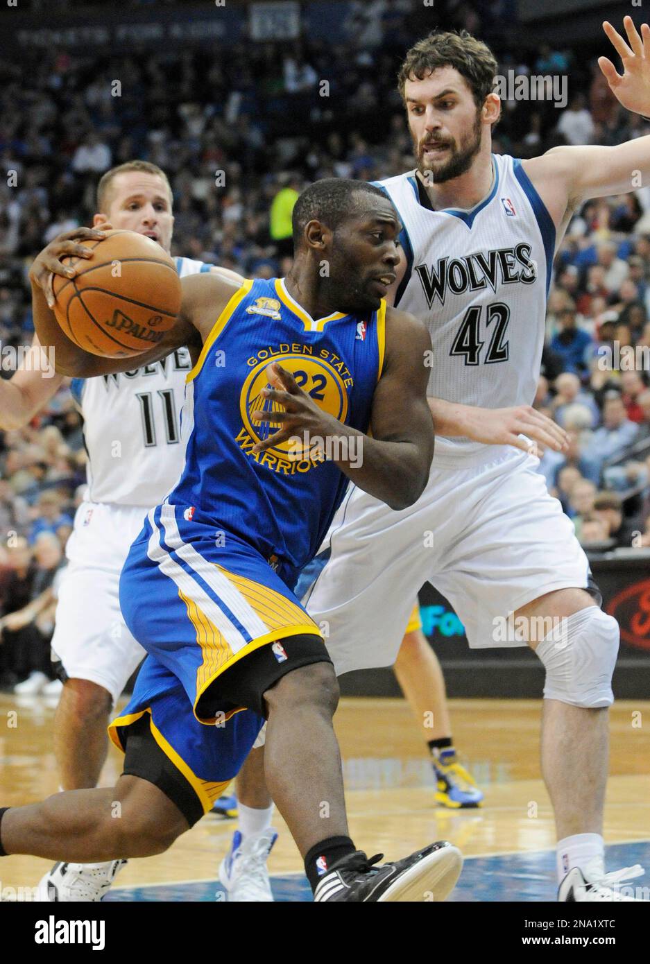 Golden State Warriors' Charles Jenkins (22) drives by Minnesota  Timberwolves' Kevin Love, right, in the second half of an NBA basketball  game, Wednesday, April 4, 2012, in Minneapolis. The Warriors won 97-94. (