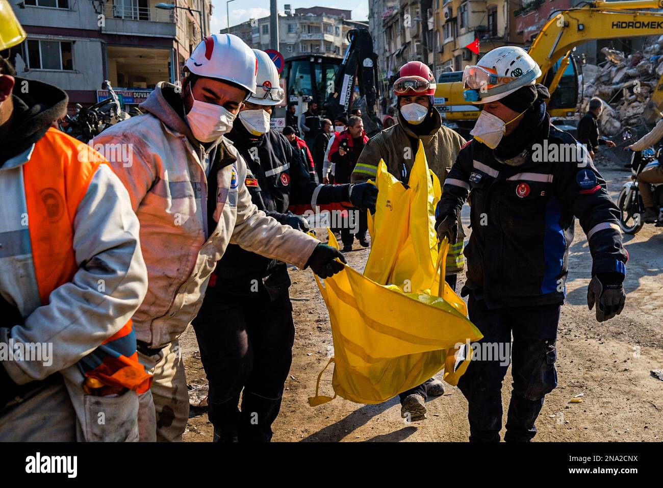 Hatay, Turkey. 12th Feb, 2023. Search and rescue teams carry the bodies of those killed by the