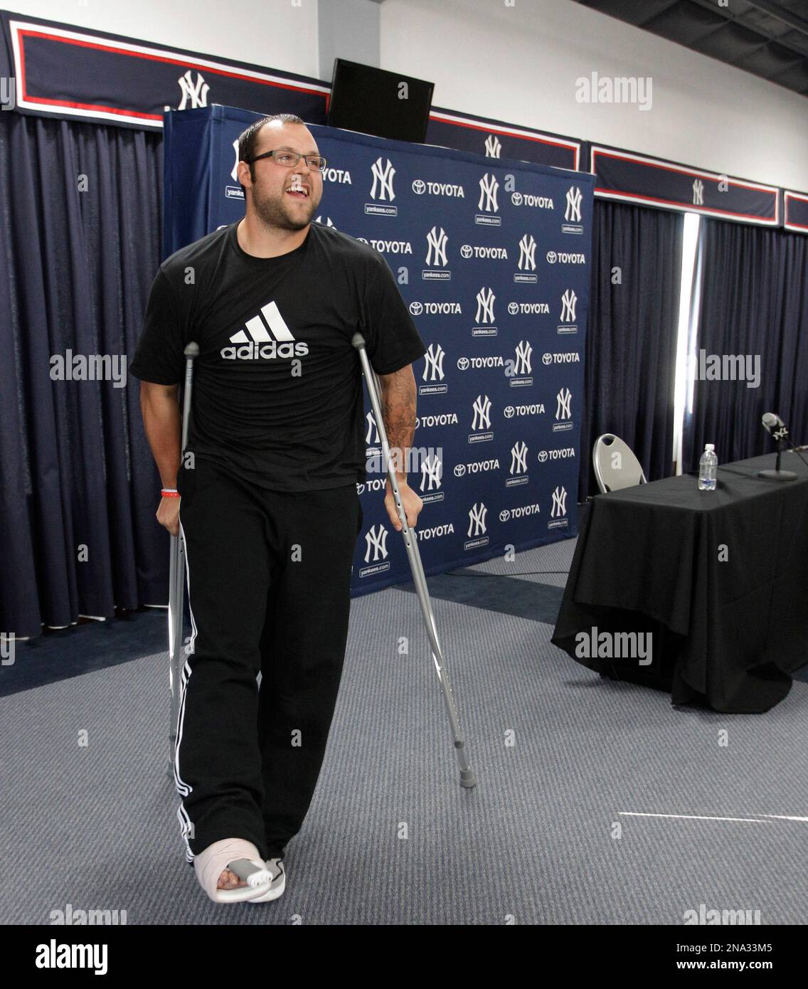 New York Yankees relief pitcher Joba Chamberlain walks on crutches after  speaking to reporters about his foot injury, in Tampa, Fla., Tuesday, March  27, 2012. Chamberlain hurt his foot jumping on a