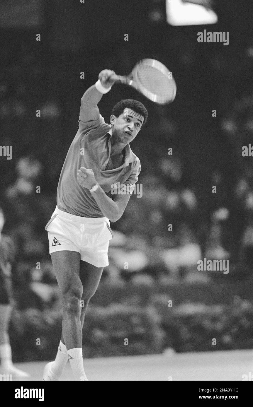 Third seeded Yannick Noah of France serves during his 76, 63 win over