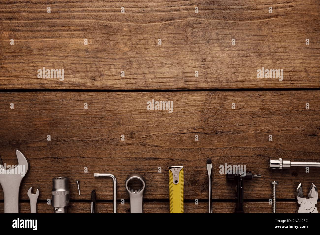 Flat lay with various work tools on wooden background working table ...