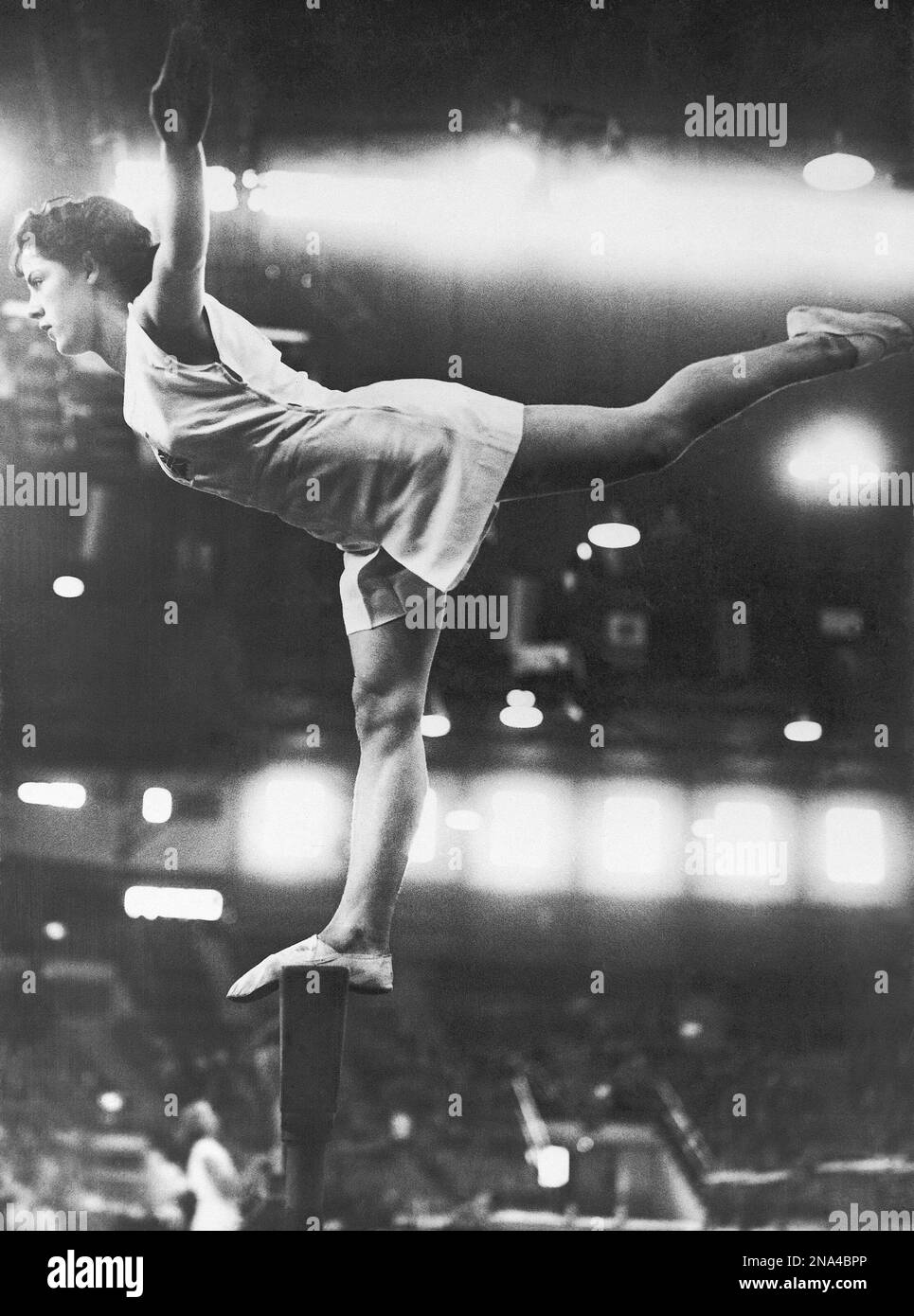 cissie-davies-of-great-britain-on-the-balancing-bar-during-the-summer