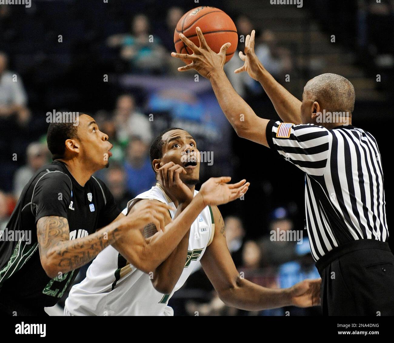Ohio forward Jon Smith, left, and South Florida forward Ron Anderson Jr ...