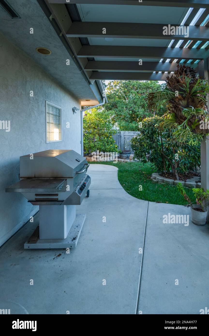 Backyard patio with barbecue grill Stock Photo Alamy