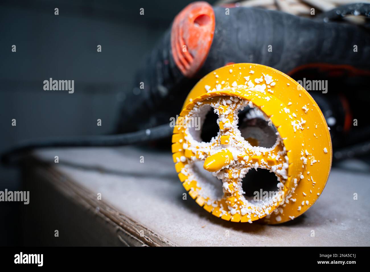 Plastic hole cutter for EPS Board Installation closeup in foam chips