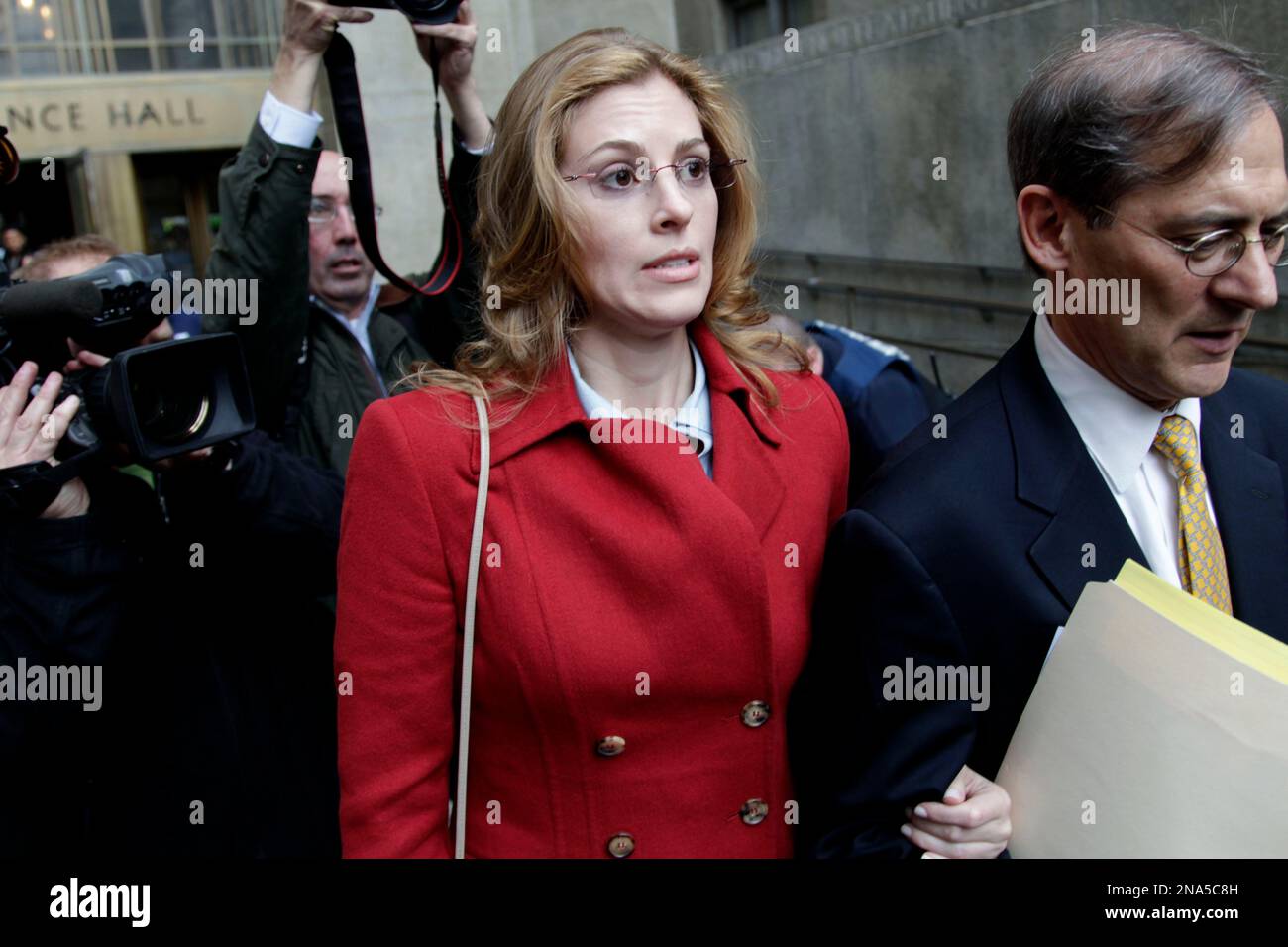 Jaynie Mae Baker leaves court with her lawyer Robert Gottlieb after her  arraignment in State Supreme Court, Tuesday, March 13, 2012 in New York.  Baker is accused of working for a high-priced