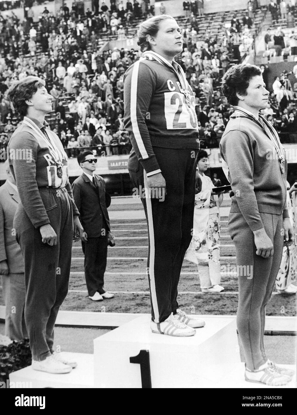 Standing on the podium at the awarding ceremony of the Women's discus throw Summer Olympic Games