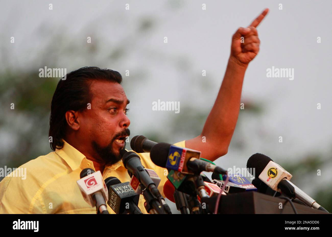 sri-lankan-housing-minister-wimal-weerawansa-speaks-during-a-rally-against-a-proposed-us-backed-un-human-rights-council-resolution-on-alleged-human-rights-abuses-during-the-countrys-civil-war-in-colombo-sri-lanka-tuesday-mar-13-2012-sri-lankas-government-has-been-organizing-protest-rallies-across-the-country-since-last-month-opposing-a-proposed-resolution-at-the-ongoing-un-human-rights-council-sessions-in-geneva-calling-on-sri-lanka-to-investigate-serious-allegations-of-human-rights-abuses-during-the-final-stages-of-the-countrys-civil-war-ap-photo-gemunu-amarasinghe-2NA5DD6.jpg