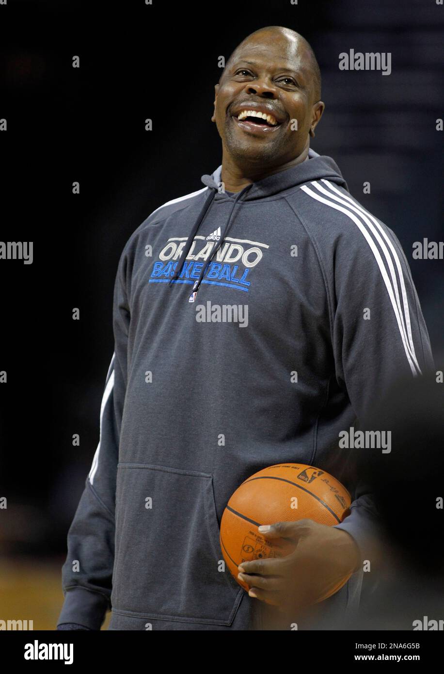 Orlando Magic assistant coach Patrick Ewing laughs during a shoot around  before an NBA basketball game against the Charlotte Bobcats in Charlotte,  N.C., Tuesday, March 6, 2012. Ewing, a former New York, image size:916x1390