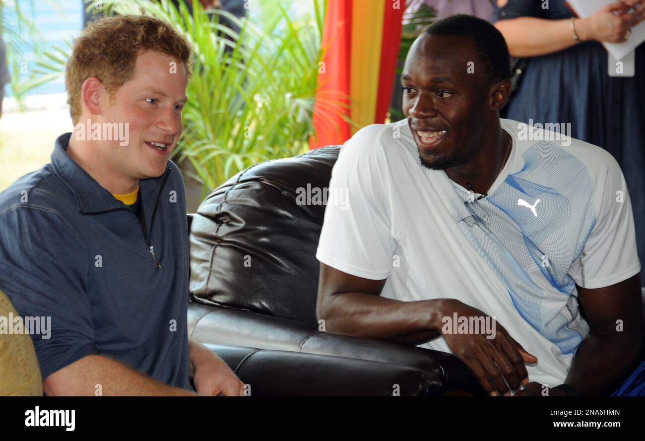 Britain's Prince Harry, left, chats with Olympic sprint champion Usain