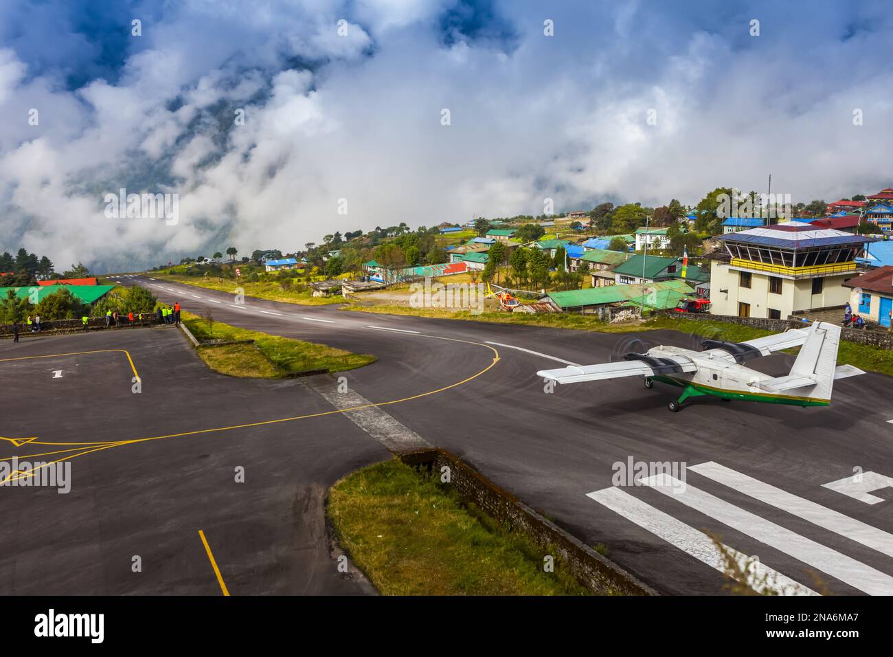 A Tara Airlines plane getting ready to takeoff on the runway, with
