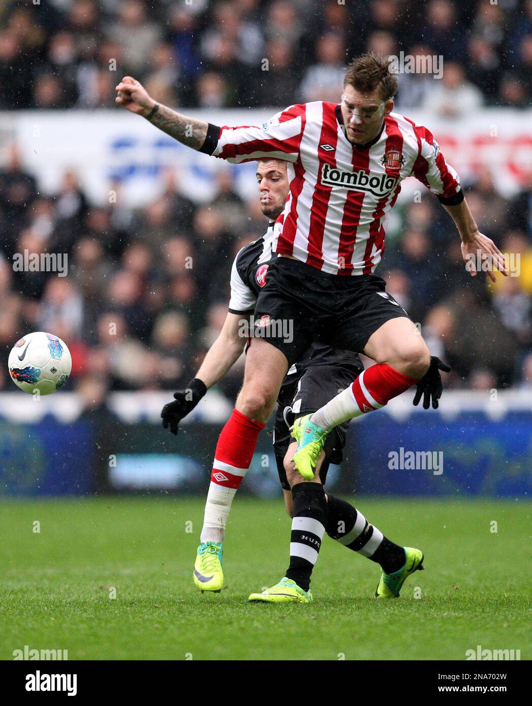 Newcastle United's Davide Santon, left, vies for the ball with