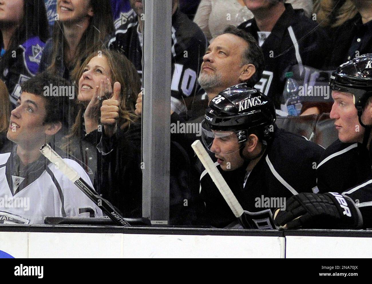 Actress Rita Wilson, second from left, and actor Tom Hanks watch the Los Angeles Kings play the Anaheim Ducks in their NHL hockey game, Saturday, March 3, 2012, in Los Angeles