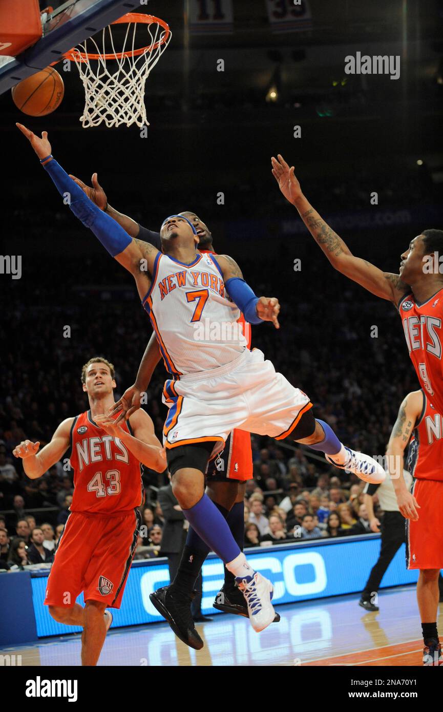 New York Knicks' Carmelo Anthony (7) puts up a shot surrounded by New Jersey Nets during the