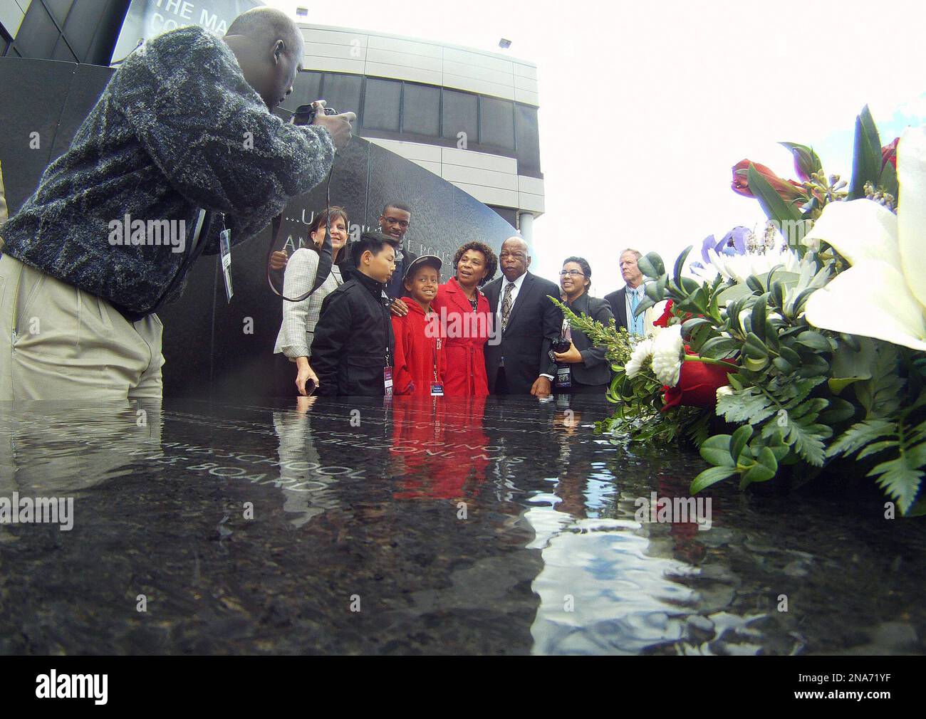 U.S. Rep. John Lewis, DGa., center, poses with those attending a