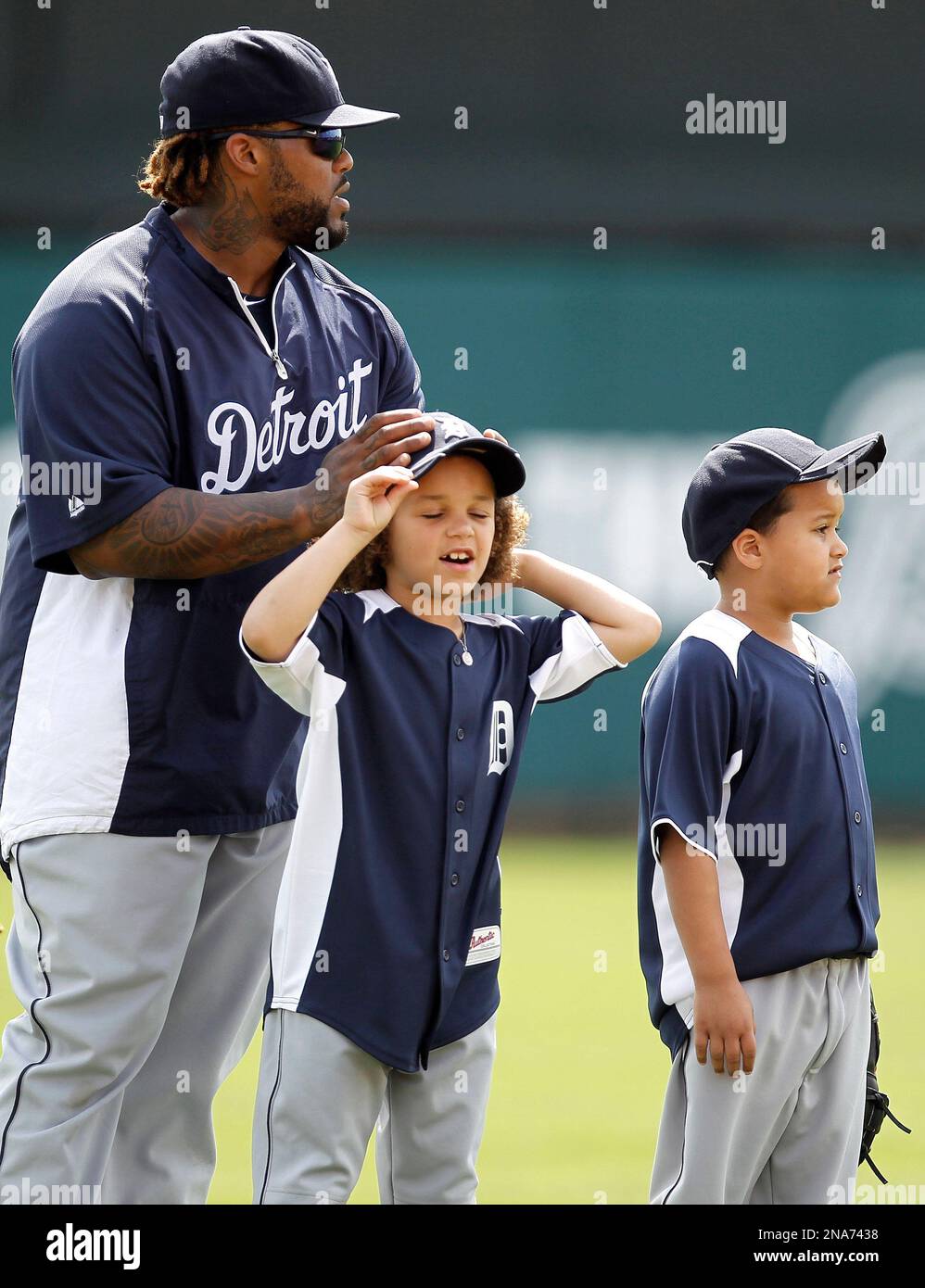Detroit Tigers first baseman Prince Fielder, top left, adjusts the