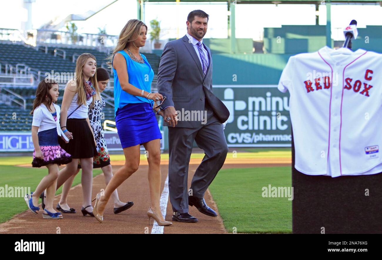 Boston Red Sox catcher Jason Varitek, right, smiles as he arrives with his  wife Catherine, and daughters Alexandra, rear center, Caroline, left, and  Kendall, rear right, at the team's spring training facility