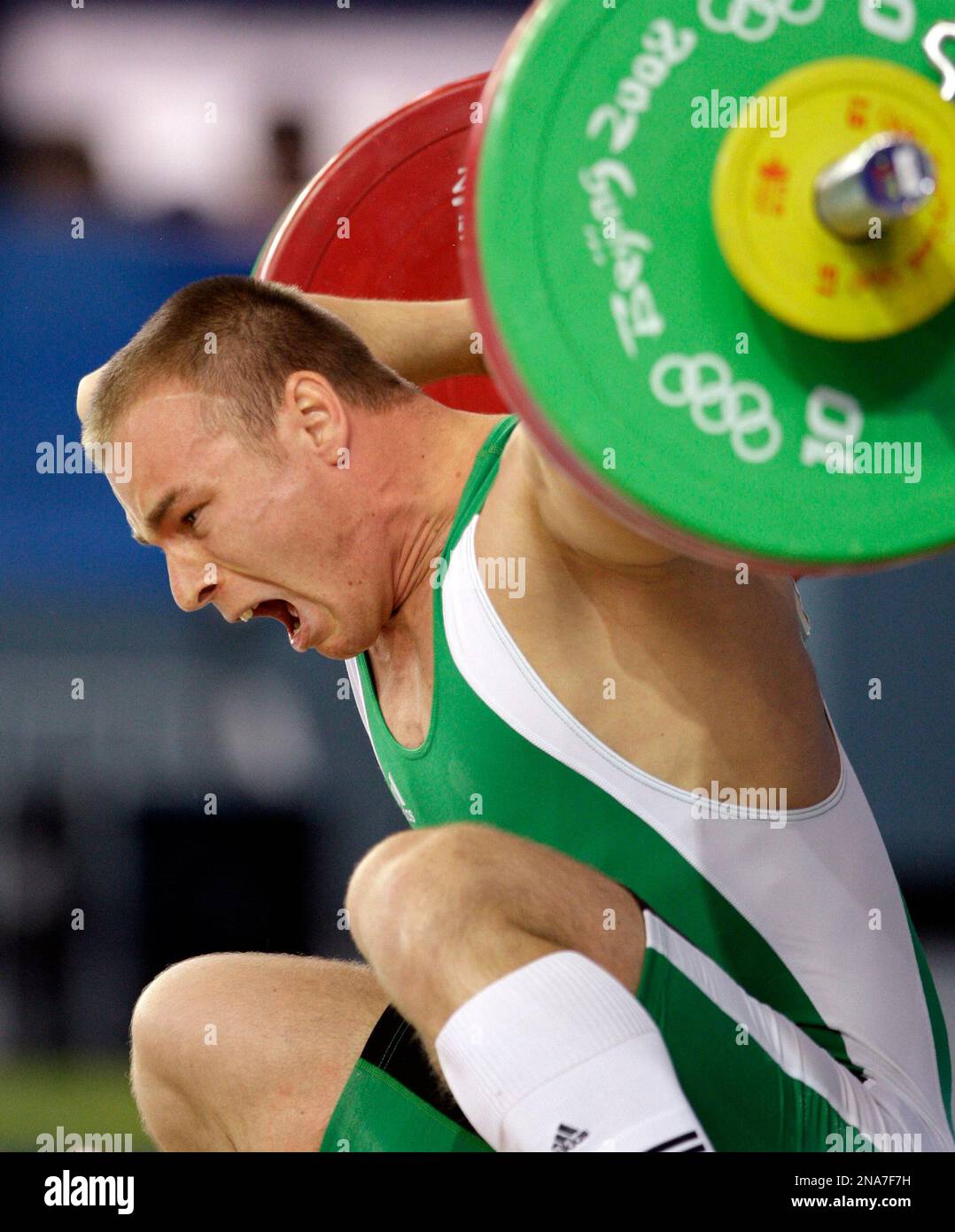 FILE - This is a Wednesday, Aug. 13, 2008 file photo of Janos Baranyai, of Hungary, loses control of the barbell twisting his right arm during competition in the Group B of the men's 77 kilogram of the weightlifting at the Beijing 2008 Olympics in Beijing. Baranyai had to be removed from the platform on a stretcher. Images of Janos Baranyai dislocating his elbow at the 2008 Olympic Games have been viewed over 15 million times on YouTube, but the weightlifter has only seen video of the injury twice. Baranyai's right elbow popped out of its socket as he was attempting to snatch 148 kilograms (32 Stock Photo
