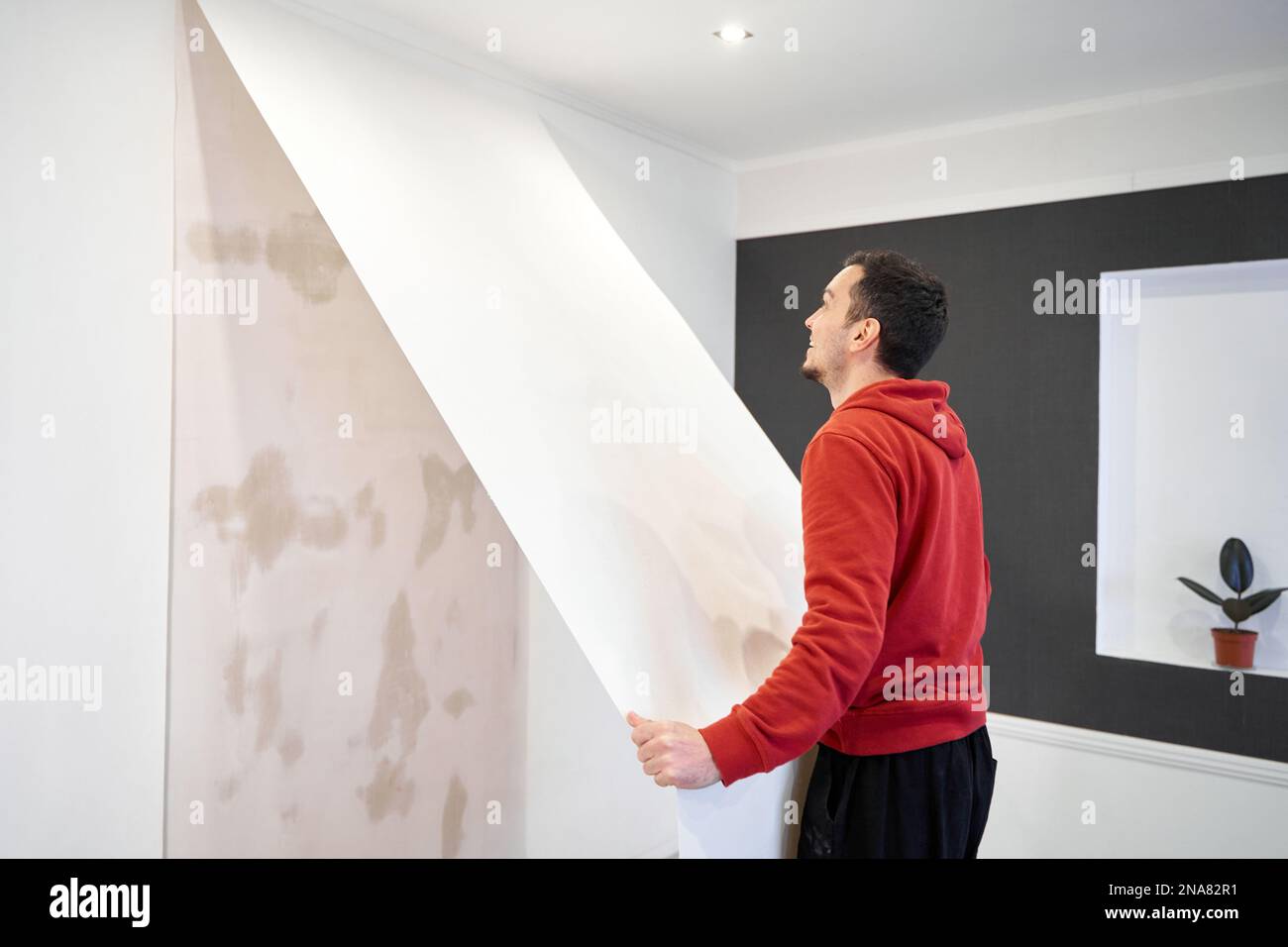 Repair the house with their own hands. The guy is ripping the old