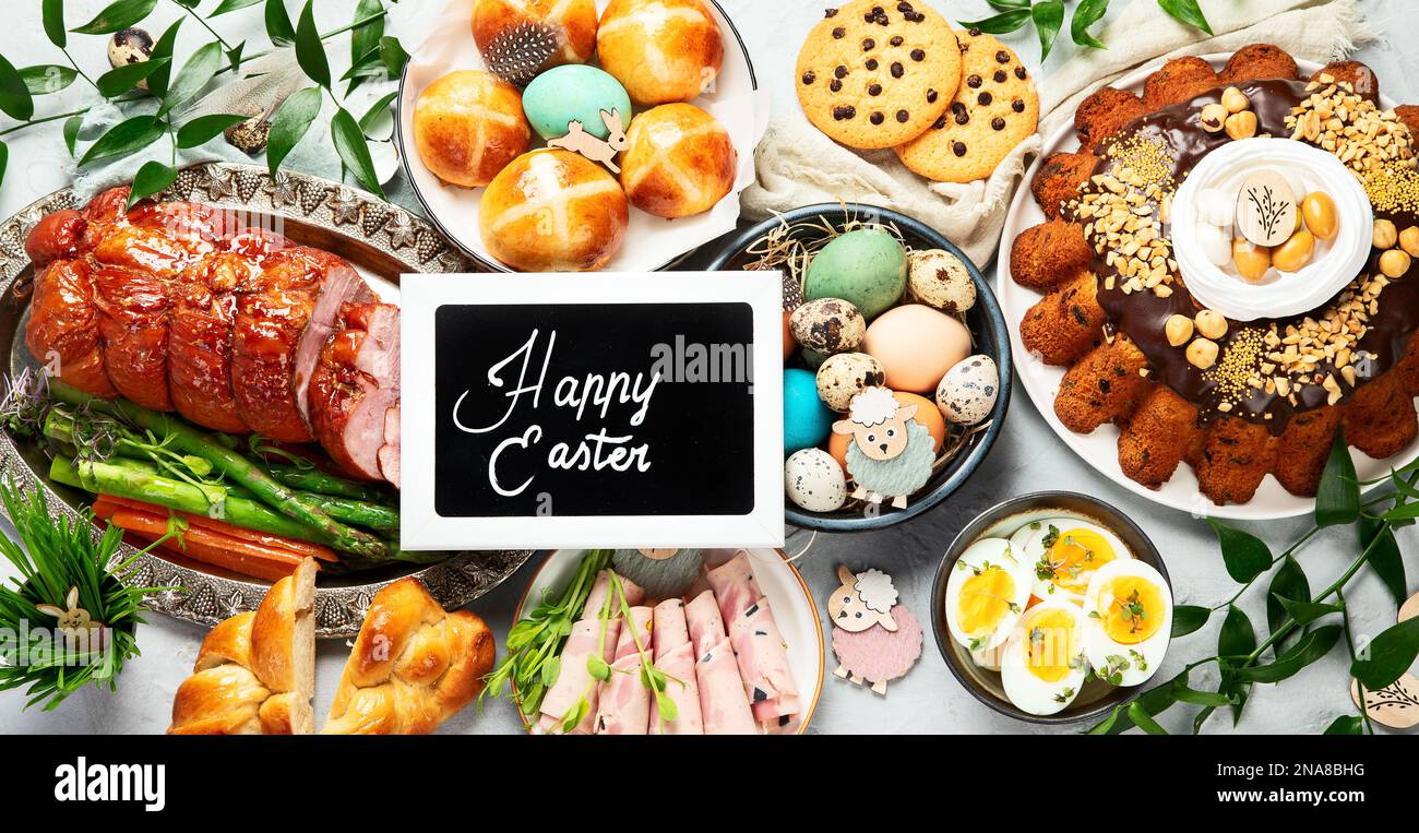 Classic Easter ham dinner. Top view table scene on a white background